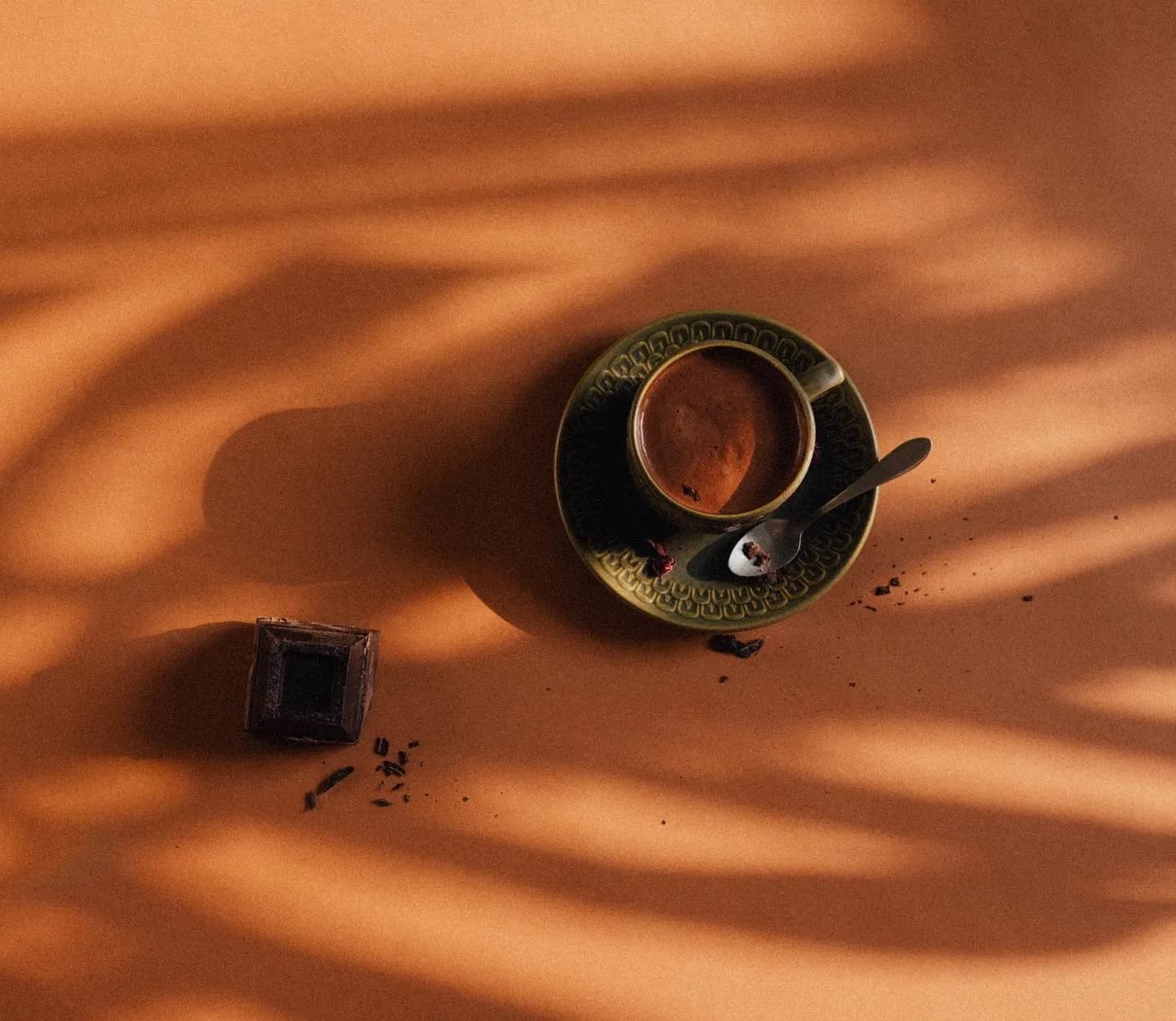 A cup of ADÉY coffee in afternoon light