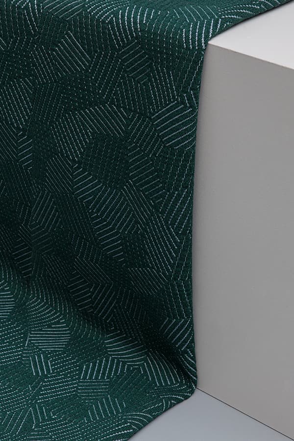 Folded green textile still life