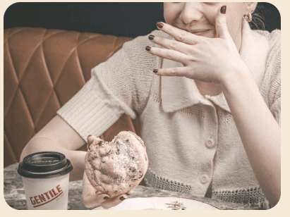 A guest enjoying ADÉY coffee and pastry